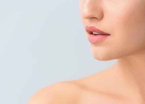 Woman's lips, chin, and jawline.