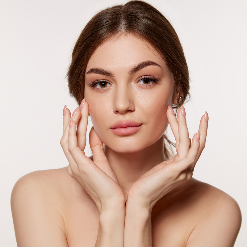 Photo of a brunette woman with plump facial features
